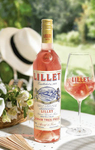 A bottle and glass of rose lillet