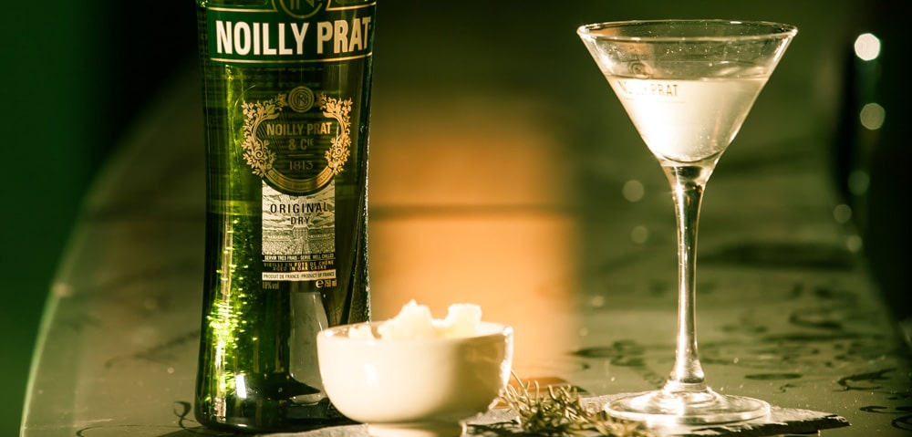 a bottle and glass of noilly prat