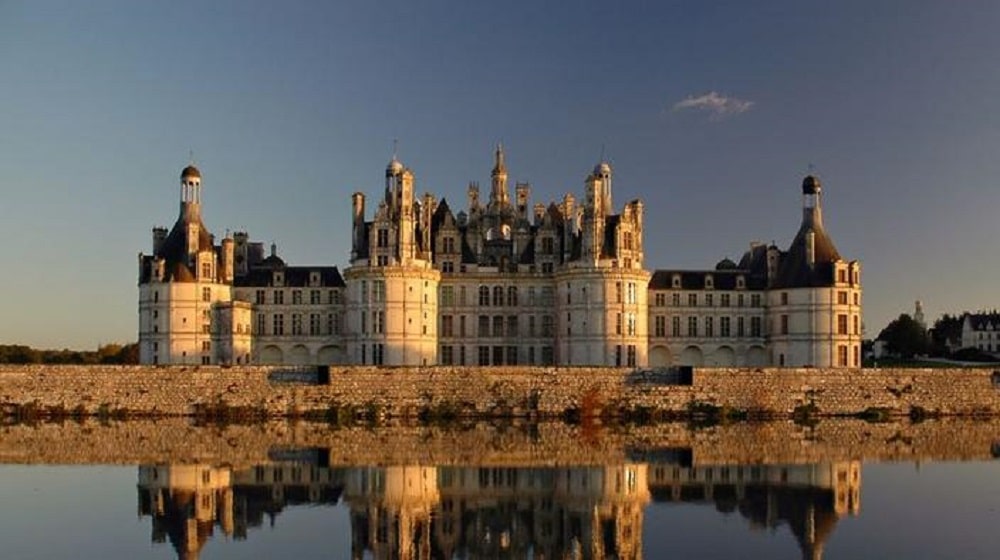 the castle of chambord during sunset