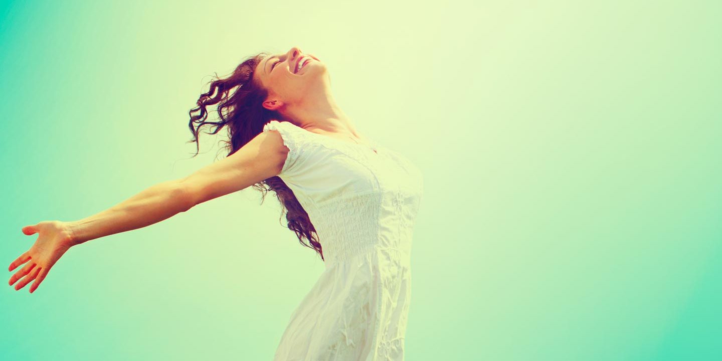 a serene woman and a green background