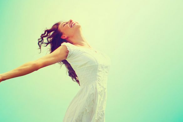 a serene woman and a green background