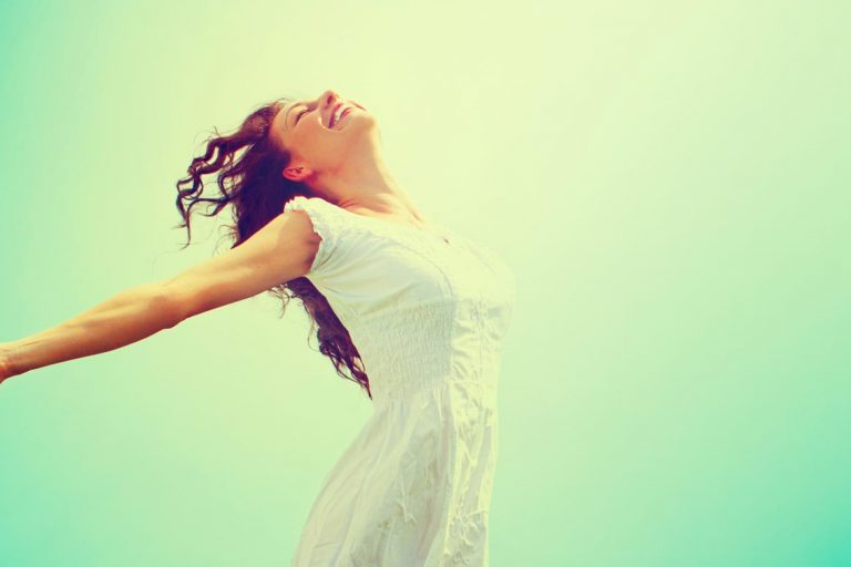 a serene woman and a green background