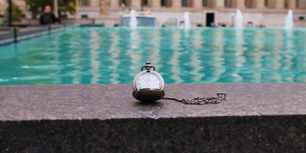 a watch near a fountain