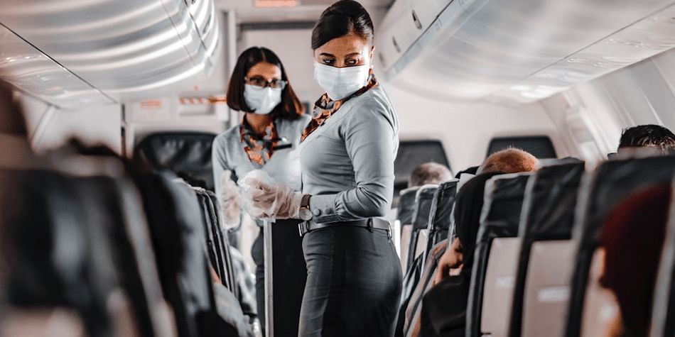 air hostess wearing mask in a plane IATA