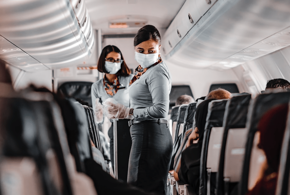 air hostess wearing mask in a plane IATA