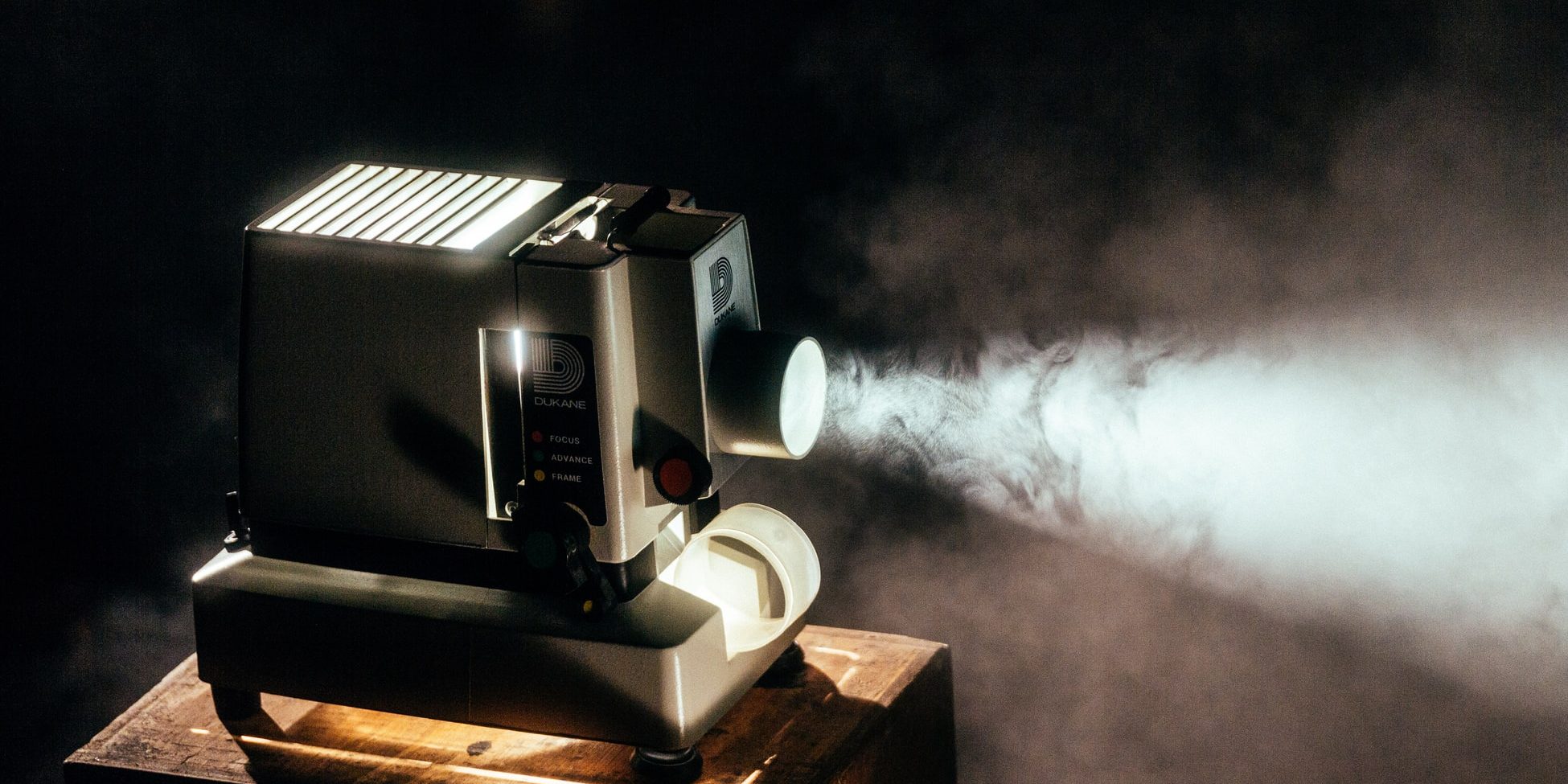 an old movie projector in a dark room