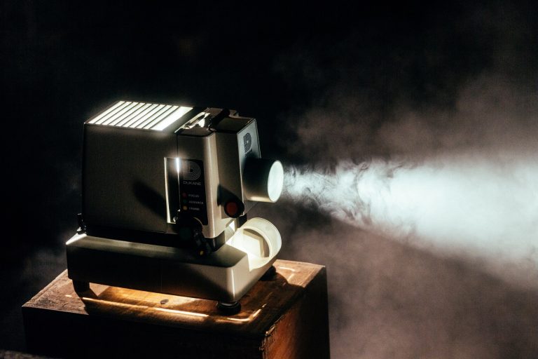 an old movie projector in a dark room